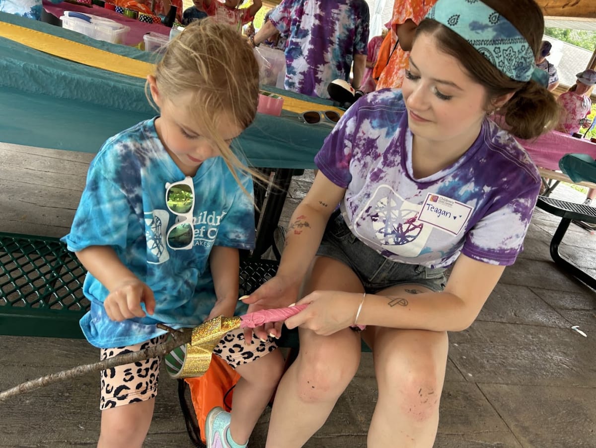 Children and volunteers participating together in Children's Grief Center summer camp activity
