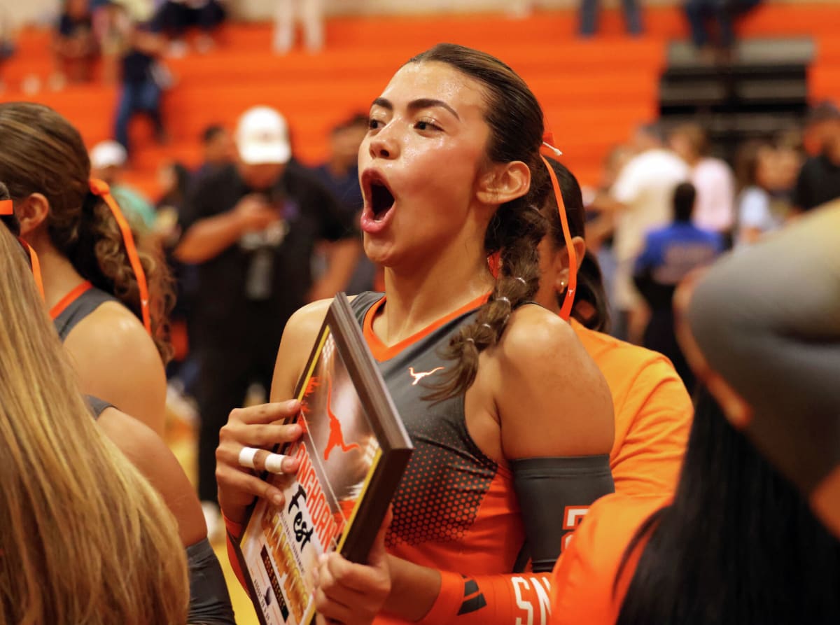 United High School Longhorns volleyball team celebrates championship victory together on home court