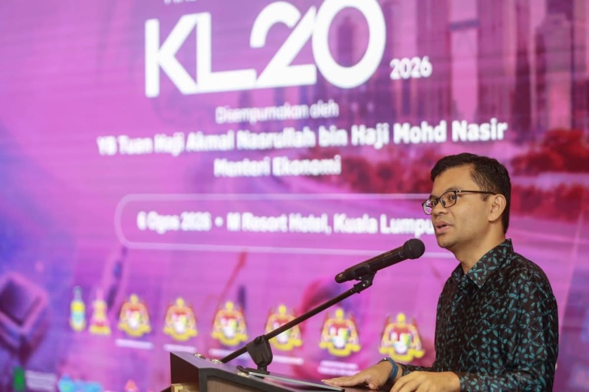 Malaysian entrepreneurs networking at technology startup summit event in modern conference venue