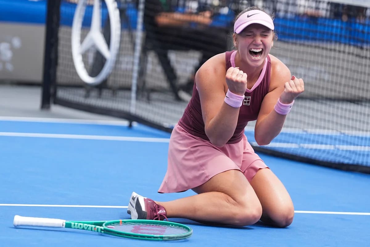 ** Sixteen-year-old tennis player Kristina Liutova celebrating on court after winning Memphis Classic championship
