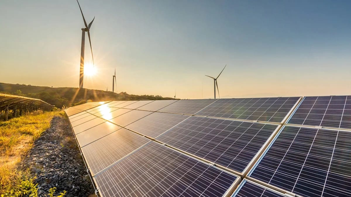 Wind turbines and solar panels generating clean renewable electricity across American landscape