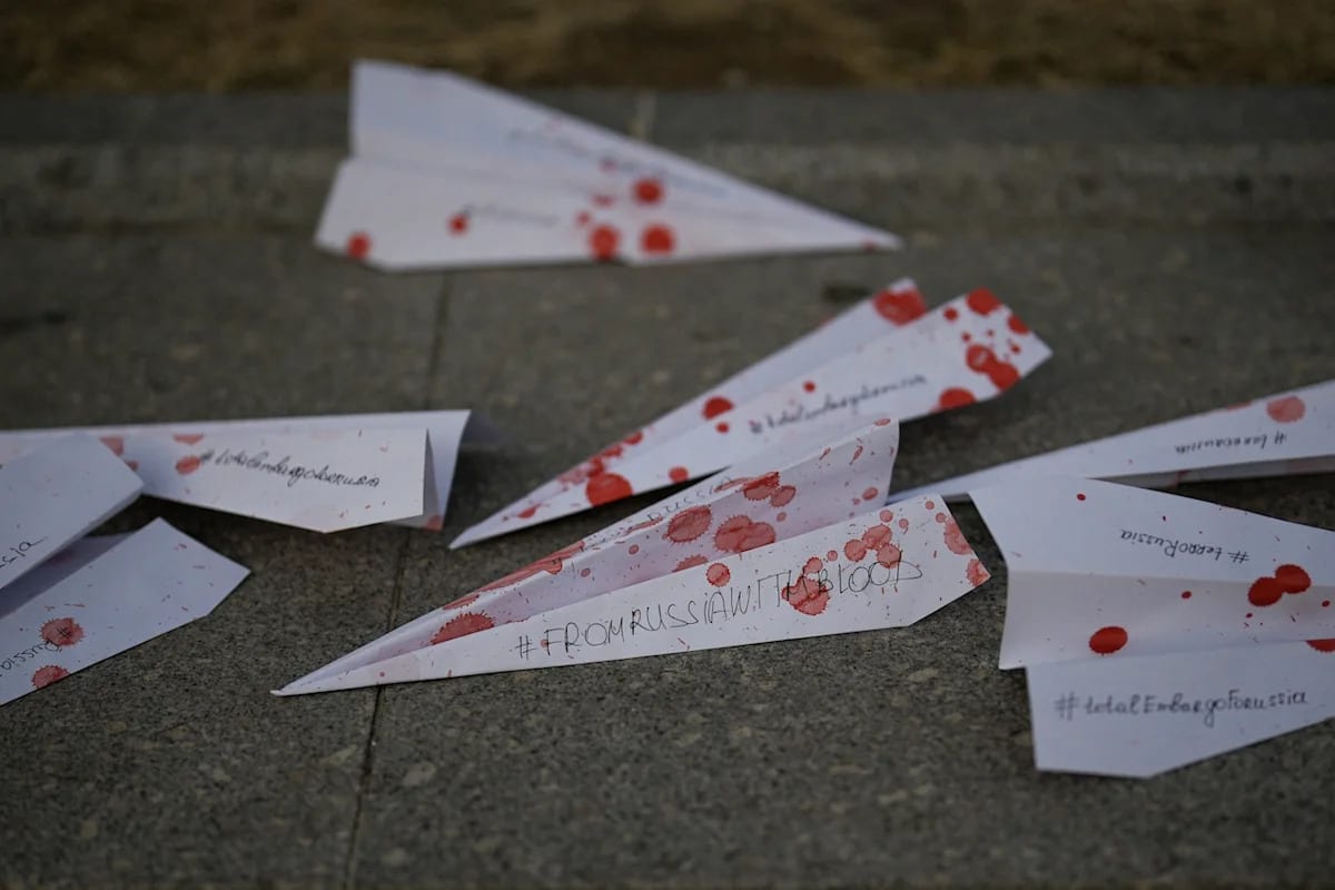 Massive paper airplane with 65-foot wingspan displayed at indoor technology expo in Bologna