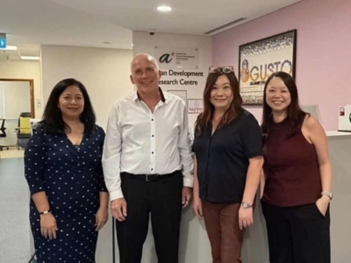 Four researchers standing together at announcement of Singapore women's health study launch