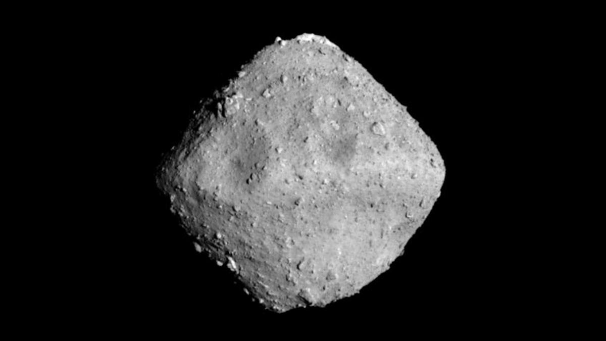 Artist rendering of asteroid Ryugu in space with samples containing DNA building blocks