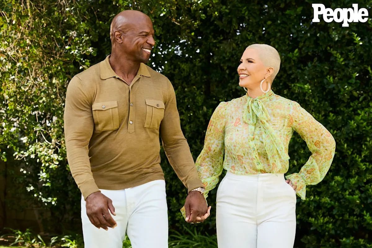 Rebecca and Terry Crews smiling together in their Los Angeles backyard after her successful treatment