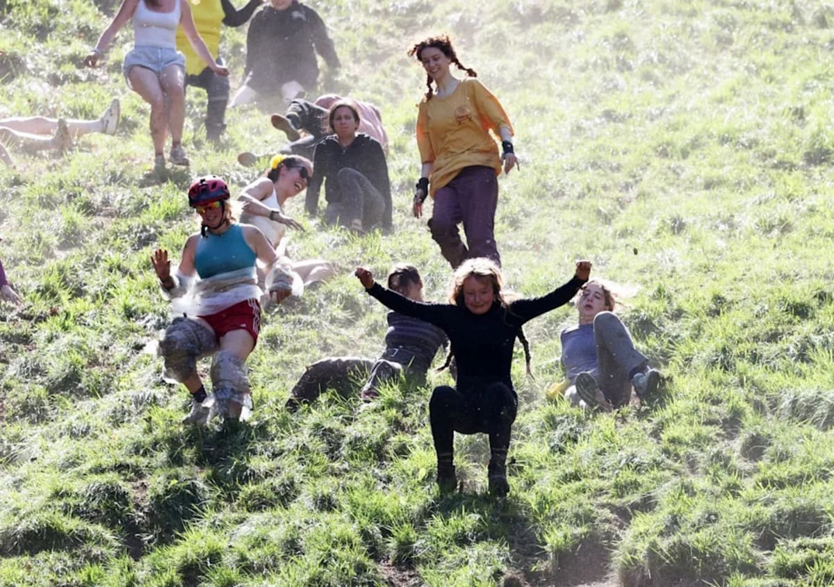 German YouTuber Wins Third Straight Cheese Rolling Title - Image 5