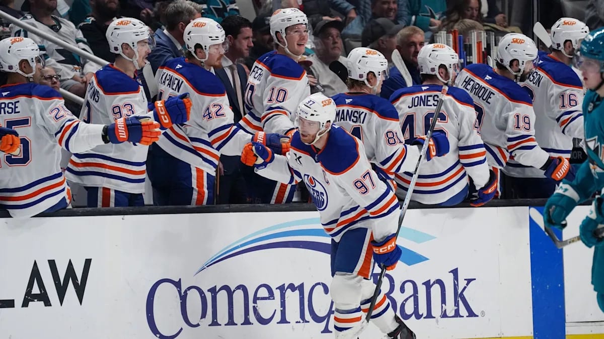 Connor McDavid celebrating on ice in Edmonton Oilers uniform after scoring goal