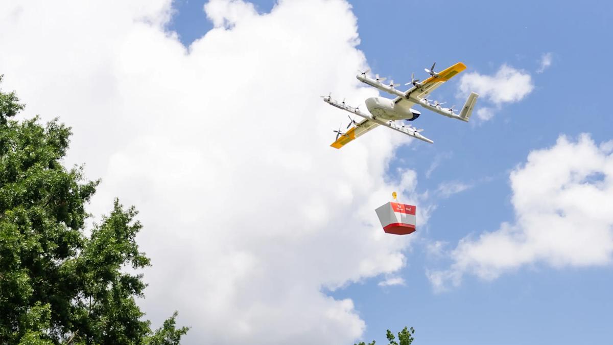 Drone carrying food delivery package flying above suburban Atlanta neighborhood