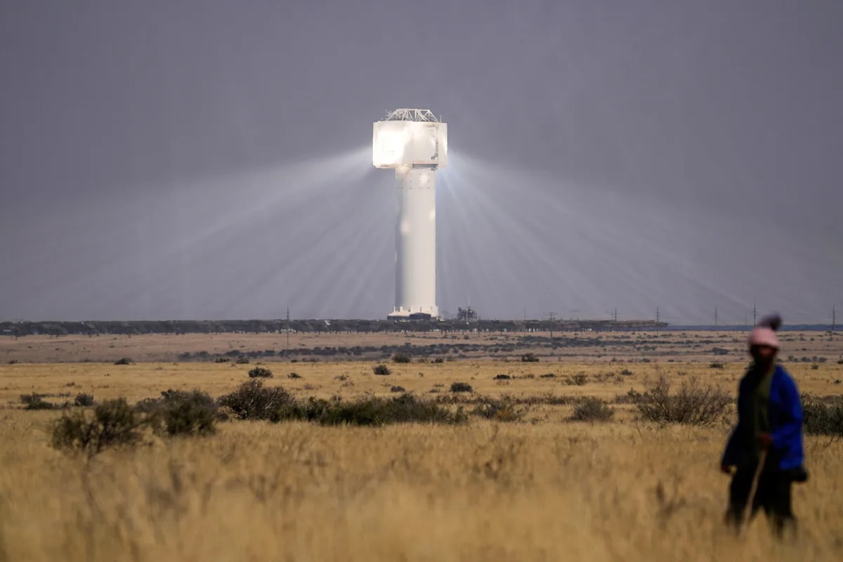 Solar panels at African solar farm gleaming under bright sunshine in open landscape