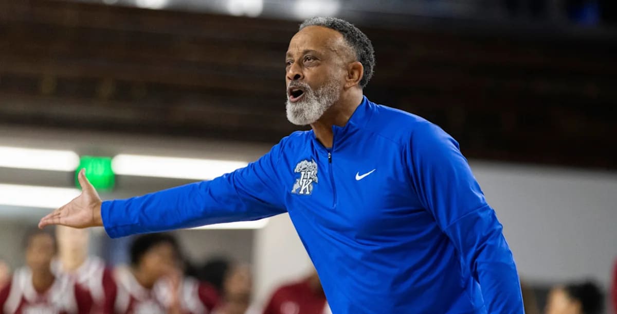 Kenny Brooks coaching Kentucky Wildcats women's basketball team from sideline during game
