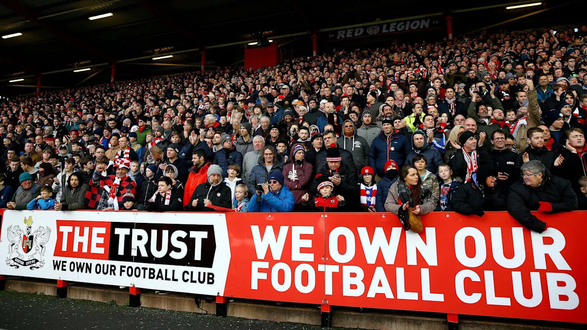 Exeter City football stadium with fans in stands showing community support for their team