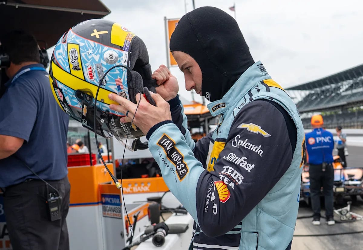 ** IndyCar driver Alexander Rossi in racing suit preparing for Indianapolis 500 despite injury