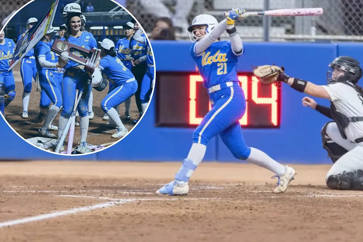 Aleena Garcia celebrating with trophy after UCLA's record-breaking win over Central Florida