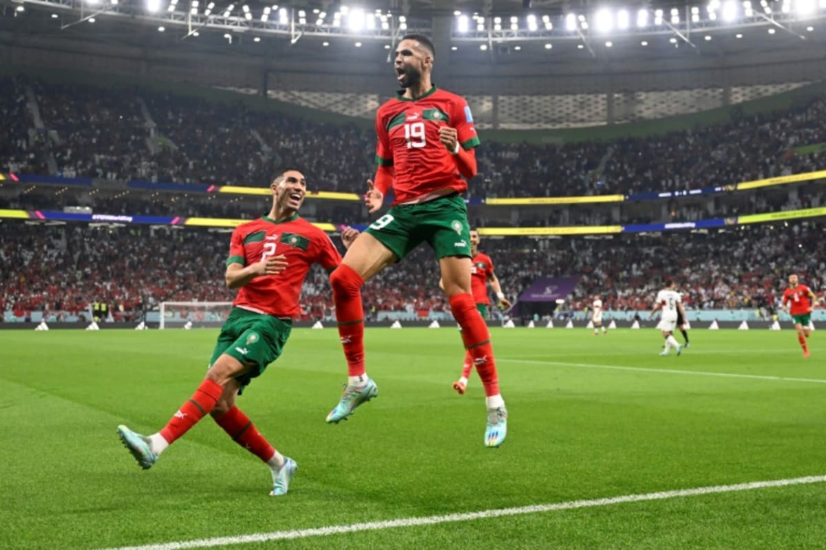 Moroccan soccer player Achraf Hakimi celebrating in national team uniform during international match