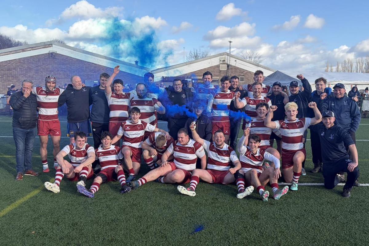 North Ribblesdale Rugby Club players celebrating together on field after winning historic third consecutive league championship