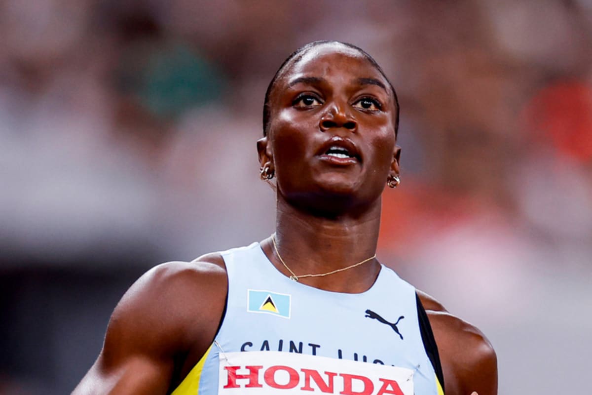 Olympic gold medalist Julien Alfred celebrating her historic 100m victory in Paris