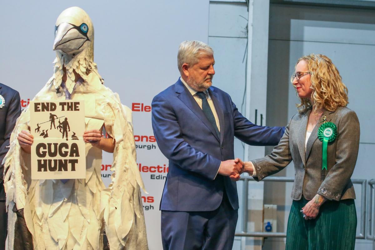 Wildlife activist Robert Pownall in large white gannet bird costume at Edinburgh election count