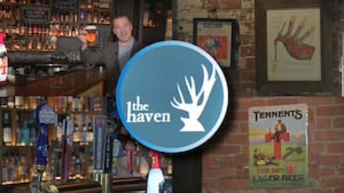 Scottish pub interior with national memorabilia and Tennent's beer tap in Jamaica Plain Boston