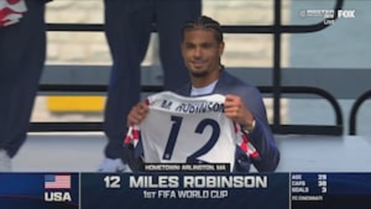 Miles Robinson in U.S. Men's National Team soccer uniform defending during a match