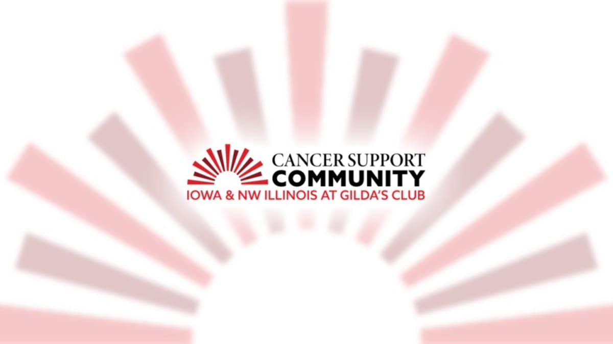 Group of cancer survivors gathering together in supportive community workshop setting at Gilda's Club