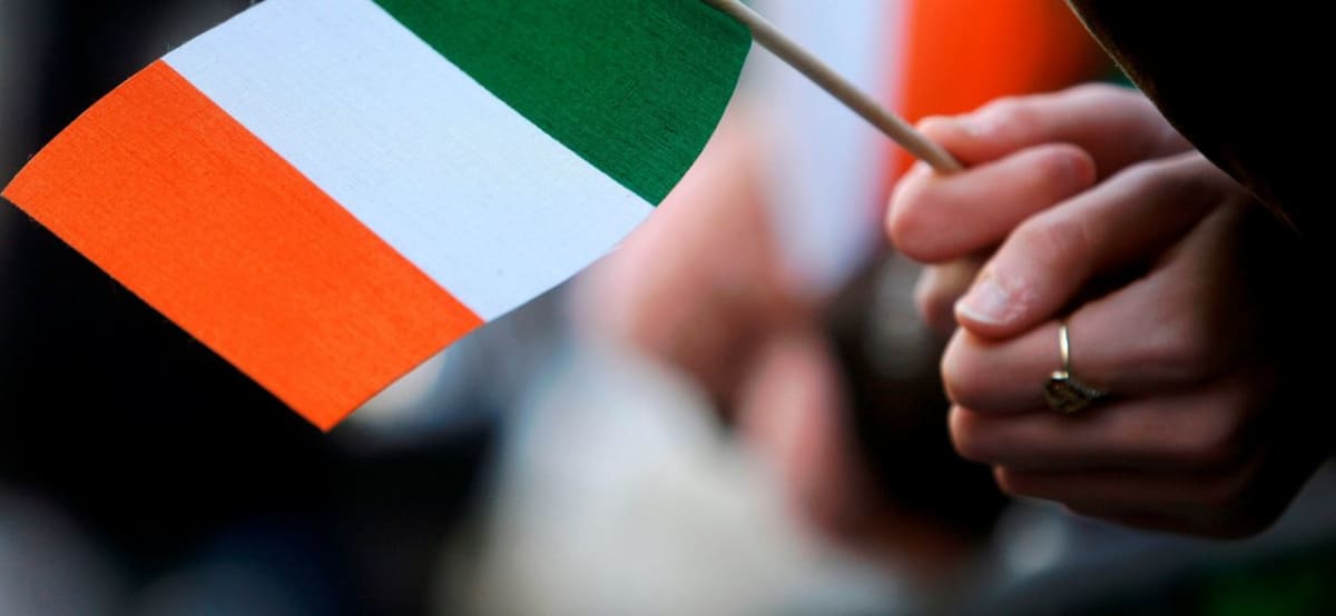 Aerial view of large crowd gathered in shamrock formation at Dublin Ohio park