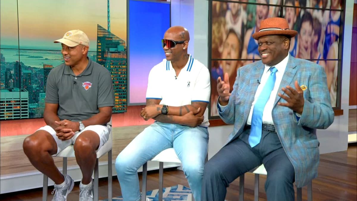 Former New York Knicks players John Starks, Stephon Marbury, and Bernard King celebrating team's championship victory
