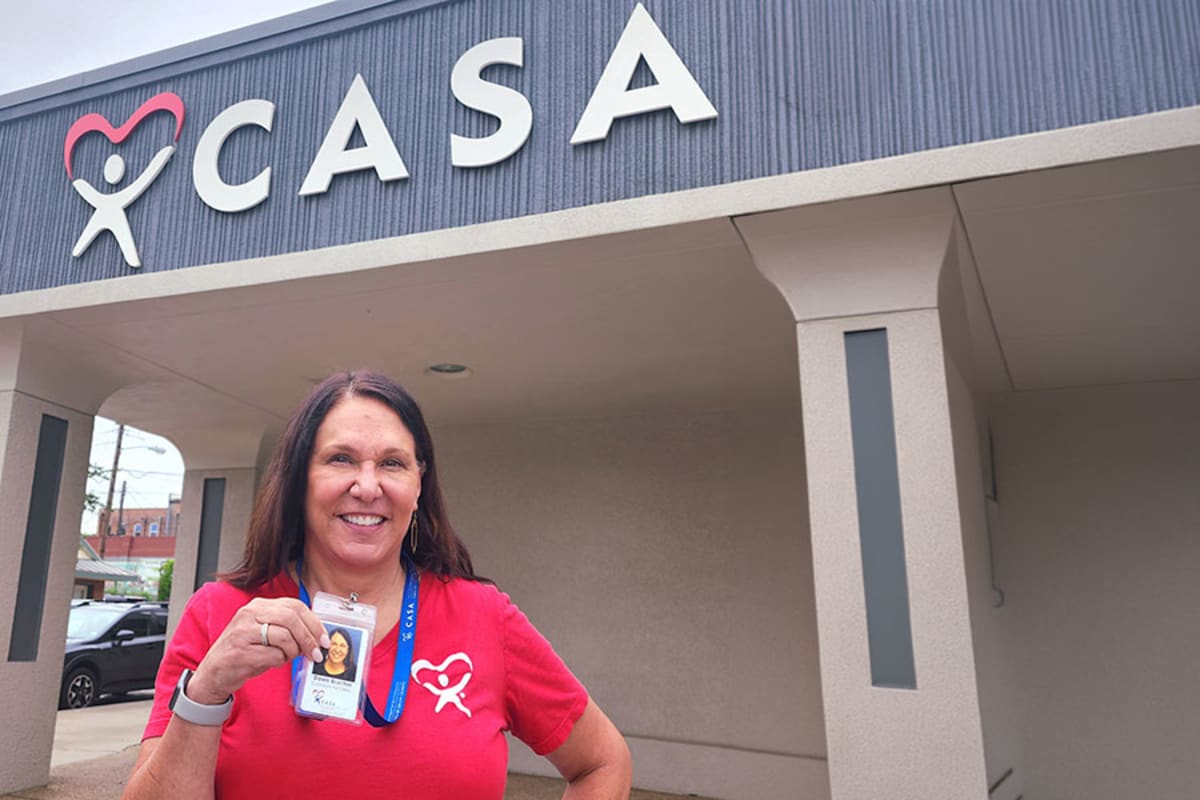 Volunteers organizing food donations at Amazing Grace Food Pantry anniversary celebration in Wylie, Texas