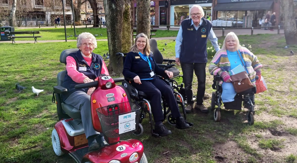 Red mobility scooter and power wheelchair available for hire in Salisbury shopping district