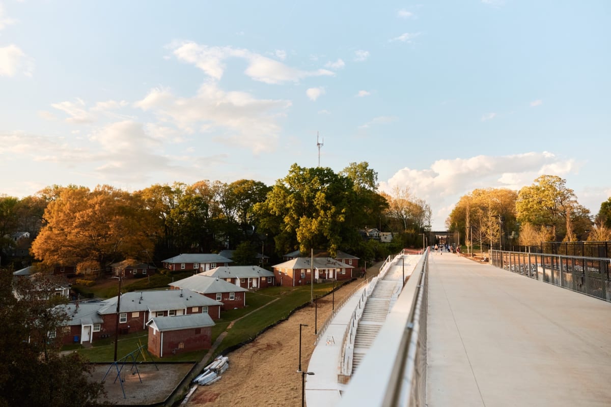 People walking and enjoying sunset on Atlanta's Southside Beltline Trail at dusk