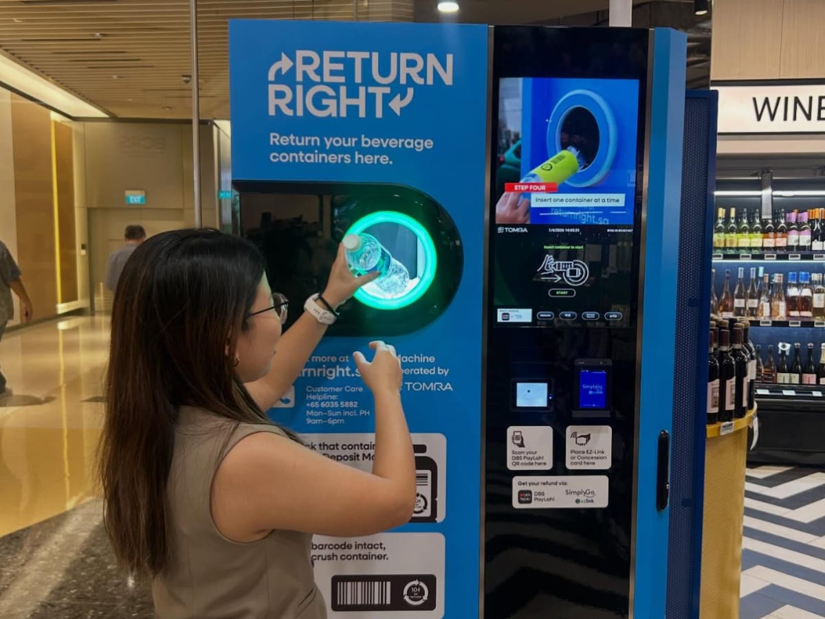 Modern recycling machine accepting bottles and cans in Singapore under new deposit return program