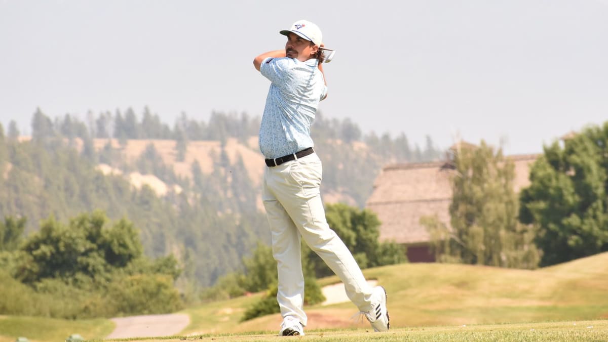 Craig Stefureak holding championship trophy at St. Eugene Golf Resort in British Columbia