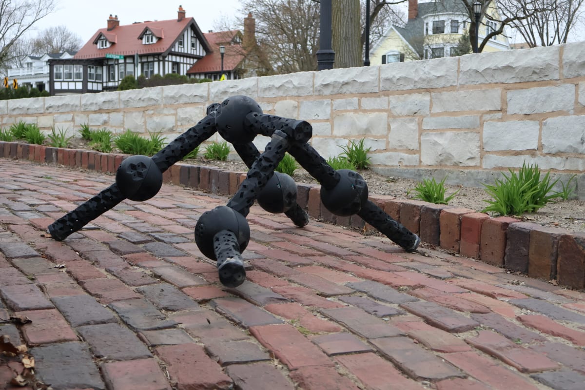 Modular legged robot made of autonomous Lego-like building blocks connected together outdoors