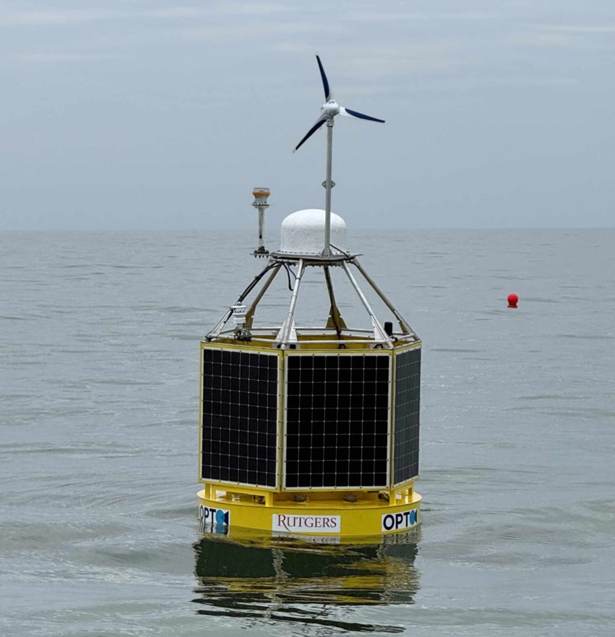 Solar-powered research buoy floating in Atlantic Ocean off New Jersey coast with instruments
