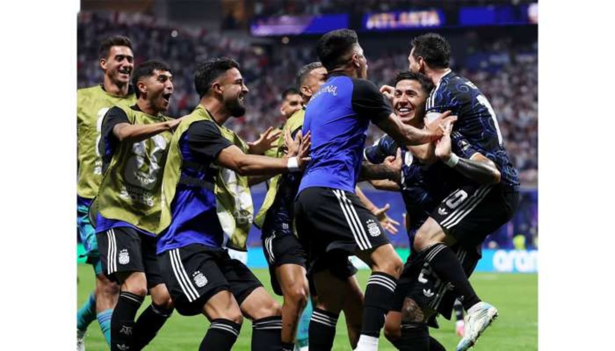 ** Argentina soccer players celebrating together after scoring winning goal against England in World Cup semifinal