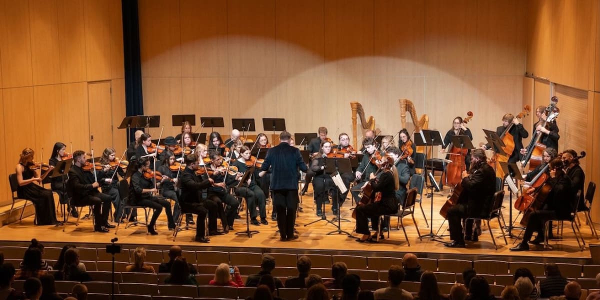 College student playing trombone during performance at Augustana University School of Music