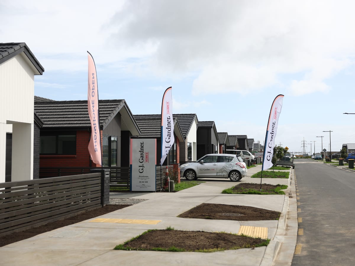 Modern townhouses and multiplexes in Auckland neighborhood showing increased housing density