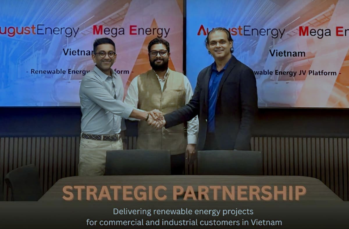 Solar panels installed on large factory rooftop in Vietnam industrial park under blue sky