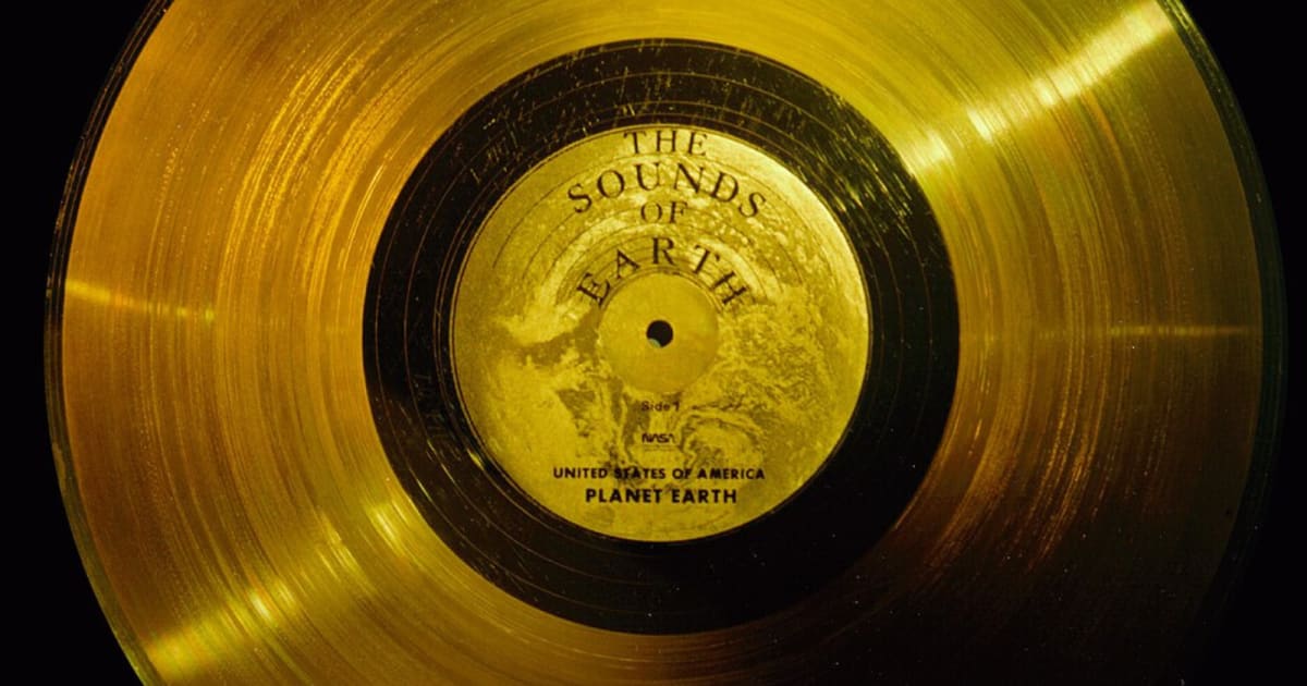 Golden record attached to Voyager spacecraft showing Earth's greetings to space