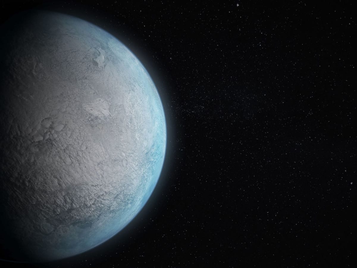 Artist's rendering of exoplanet K2-18 b with ocean surface beneath cloudy hydrogen atmosphere