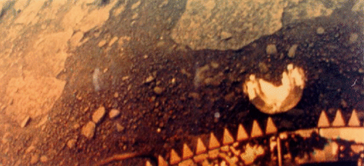 Soviet Venera 13 lander's first color photograph showing rocky Venus surface in orange light