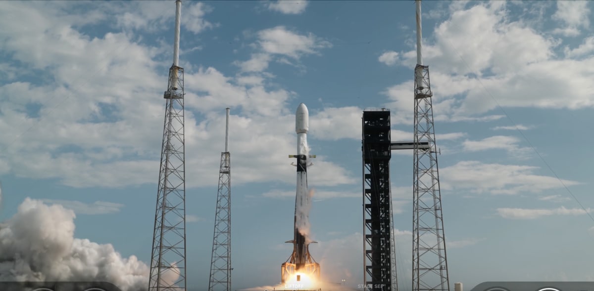 Robotic spacecraft with extended arms approaching satellite in Earth orbit for life extension mission