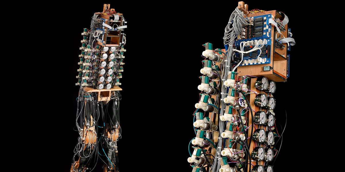 Shadow Walker bipedal robot with wooden skeleton and pneumatic air muscles standing upright