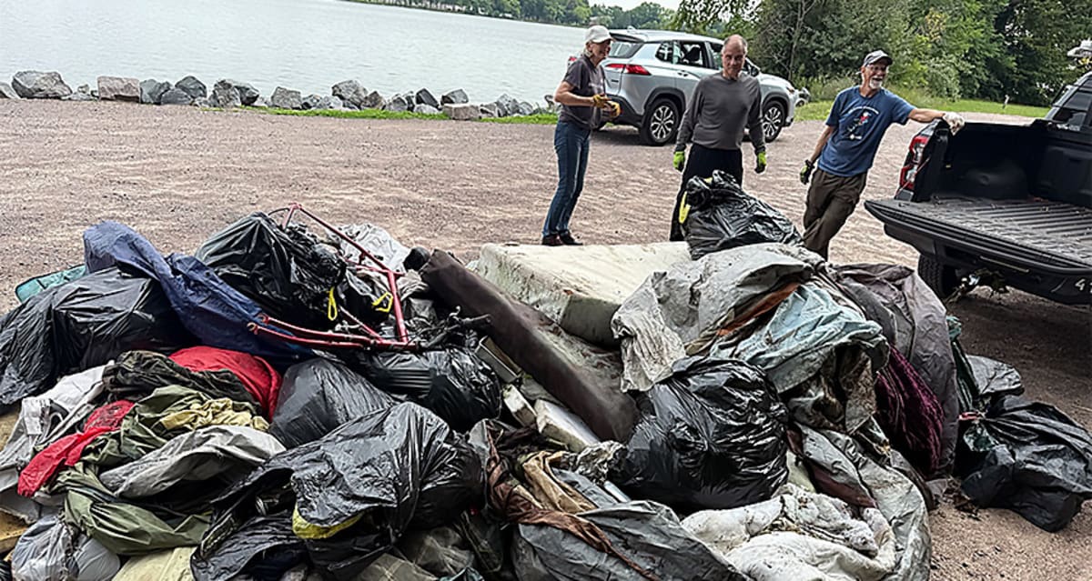 Volunteers and police officers working together on community cleanup in Stevens Point Wisconsin