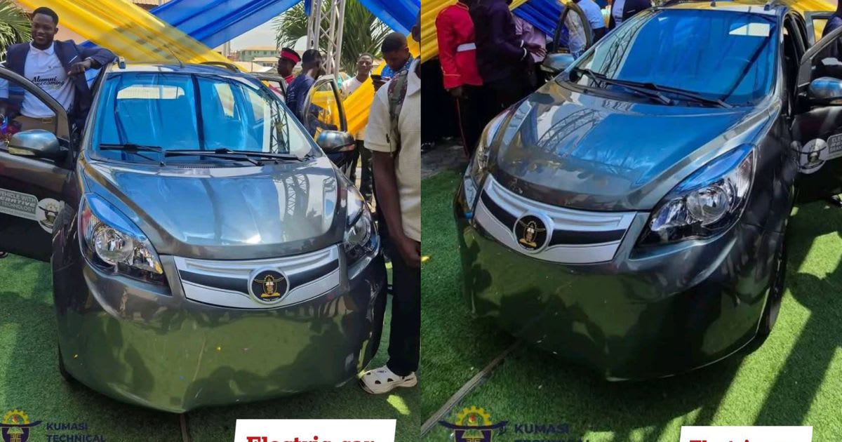 ** Three Ghanaian engineering students standing beside their self-charging electric vehicle at university unveiling ceremony