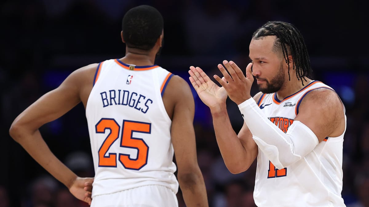 New York Knicks players celebrating together on basketball court during NBA playoffs