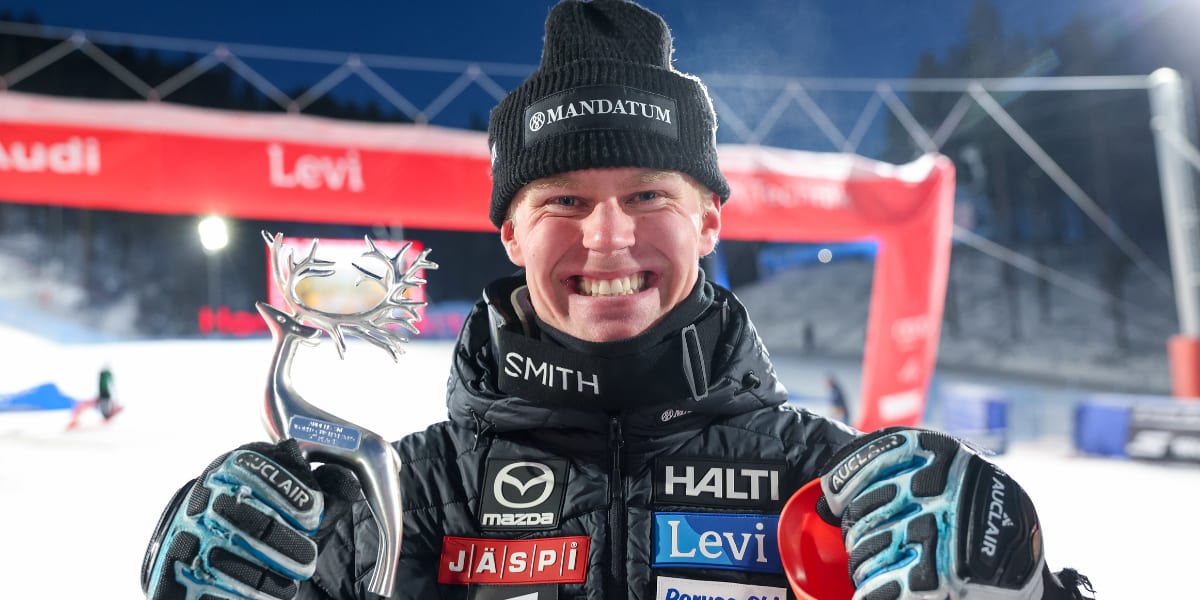 Finnish slalom skier Eduard Hallberg racing downhill in blue suit during World Cup competition
