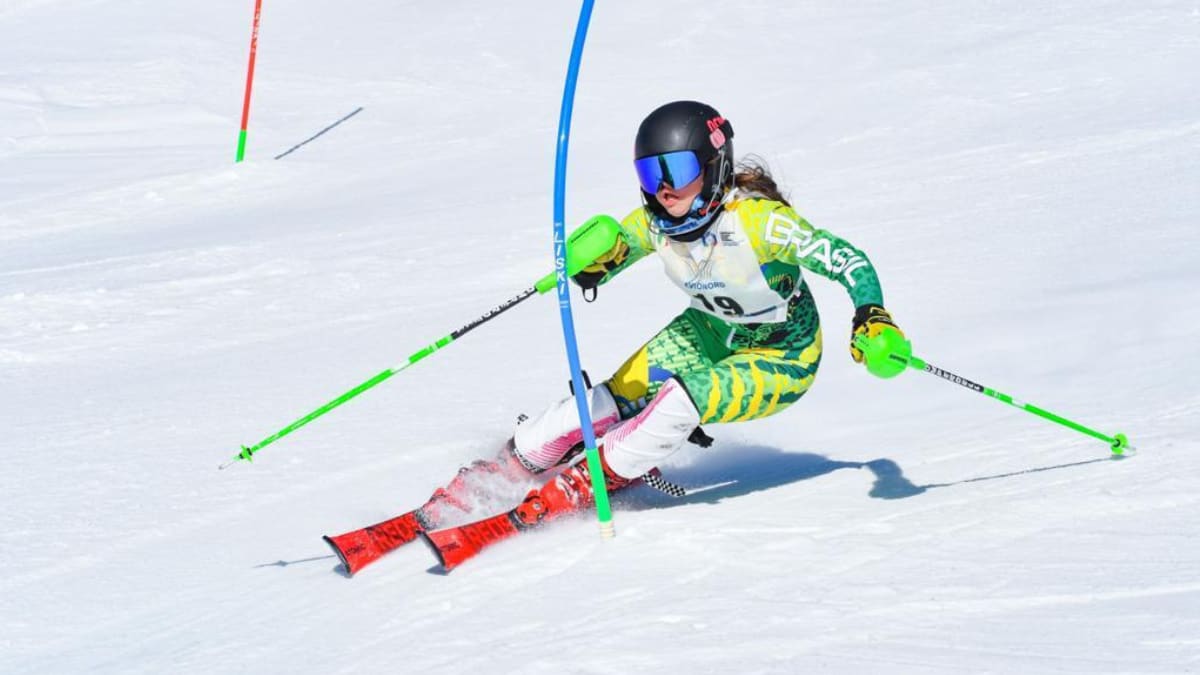 Twin teenage skiers Carlotta and Leopoldo Pignaton Fagnani wearing custom Brazilian racing uniforms