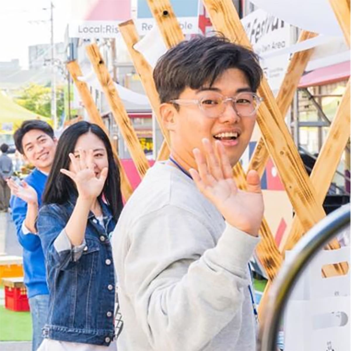 Young entrepreneurs standing in front of their colorful booths at Localize Festival 2019 in Gunsan, South Korea