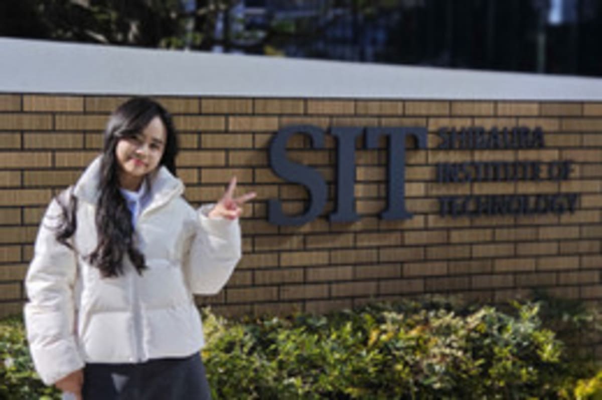 Vietnamese and Japanese students collaborating on semiconductor technology in modern innovation laboratory