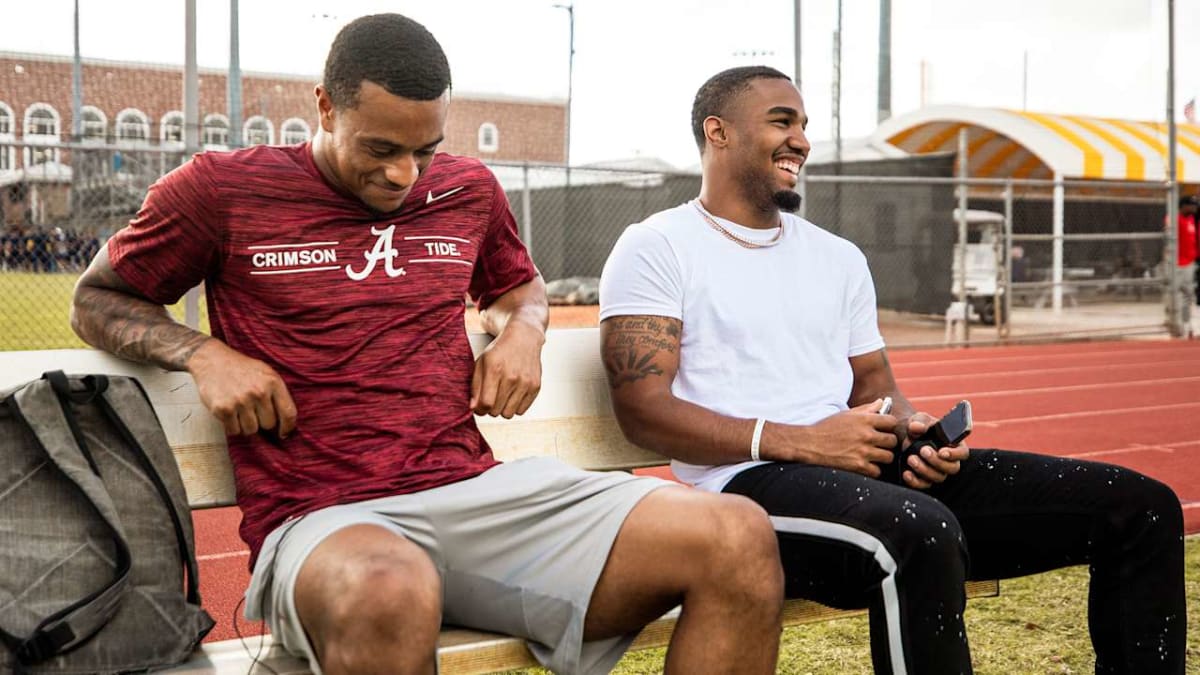 Denver Broncos cornerback Pat Surtain II celebrating on the field in orange jersey